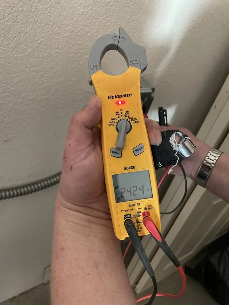 Voltage testing with clamp meter during Aluminum Wiring Replacement in Nelson